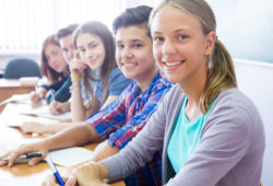 teens in classroom group of students sitting in the classroom at school